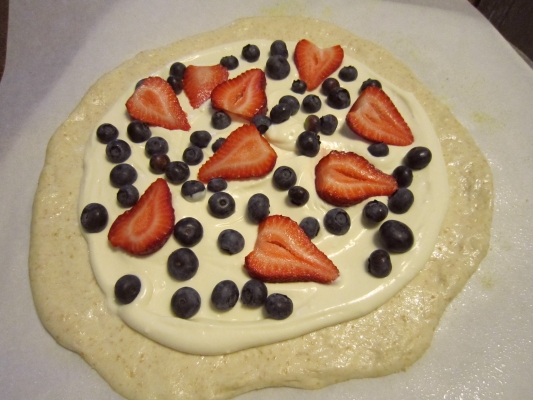 Pizza with added topping and fruit